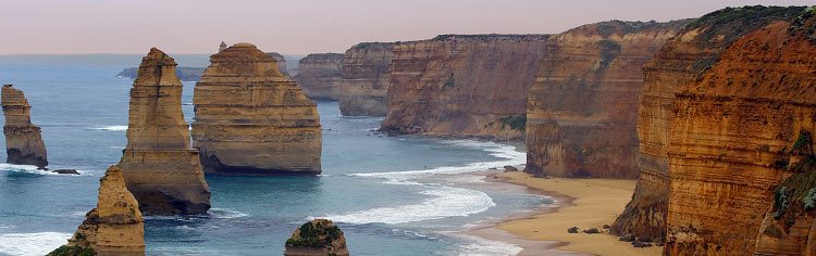 A clear sea around high cliffs - All About Truth Banner